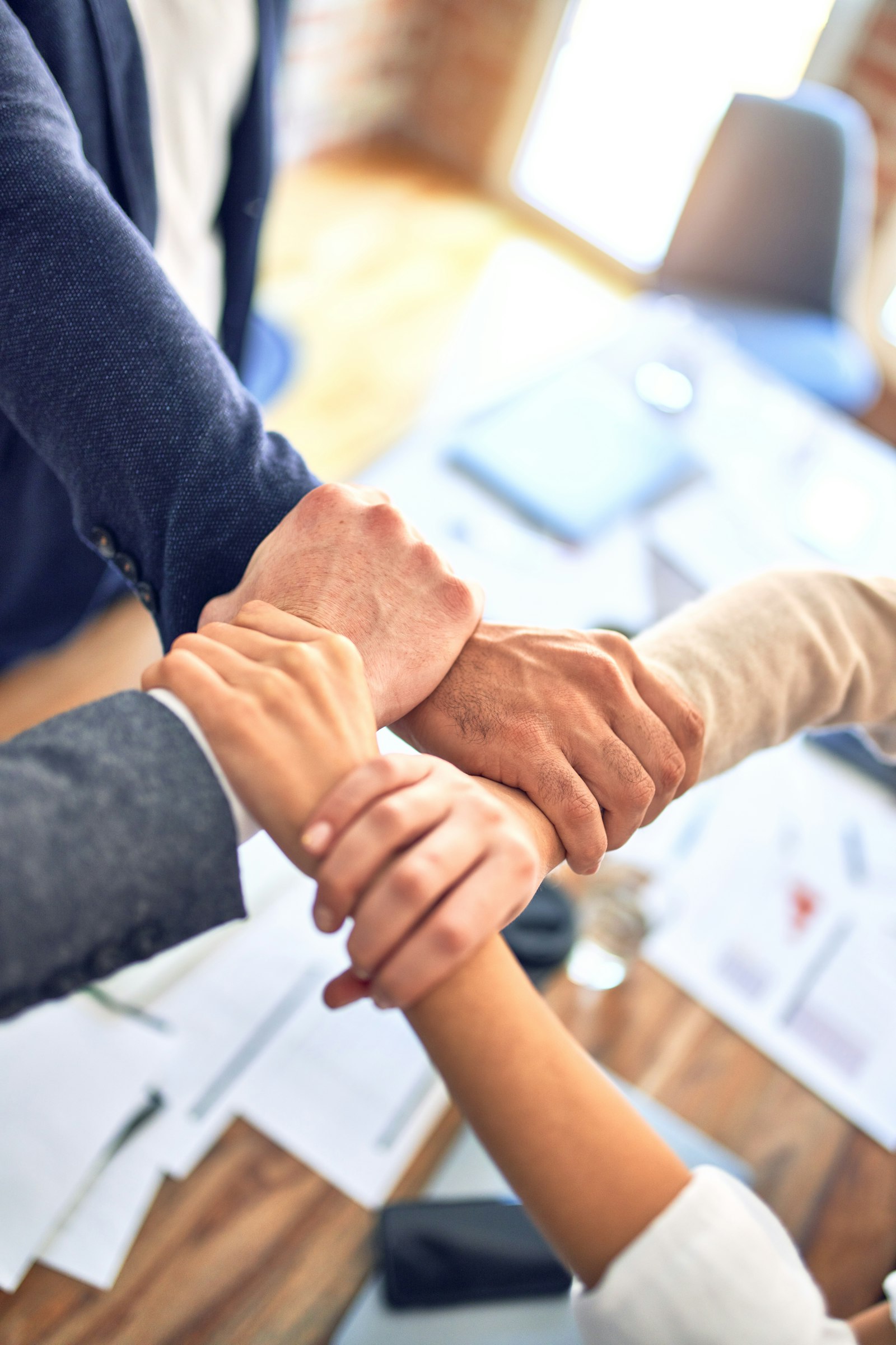 Colleagues shaking hands in an office